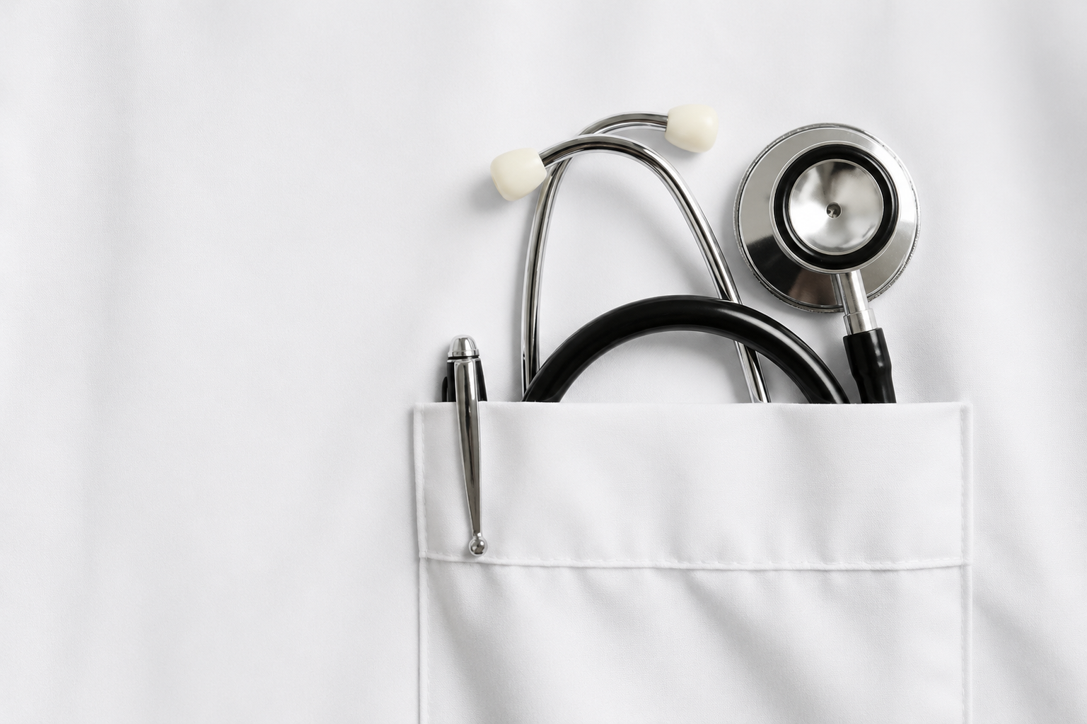 Stethoscope arranged on a white clinical surface