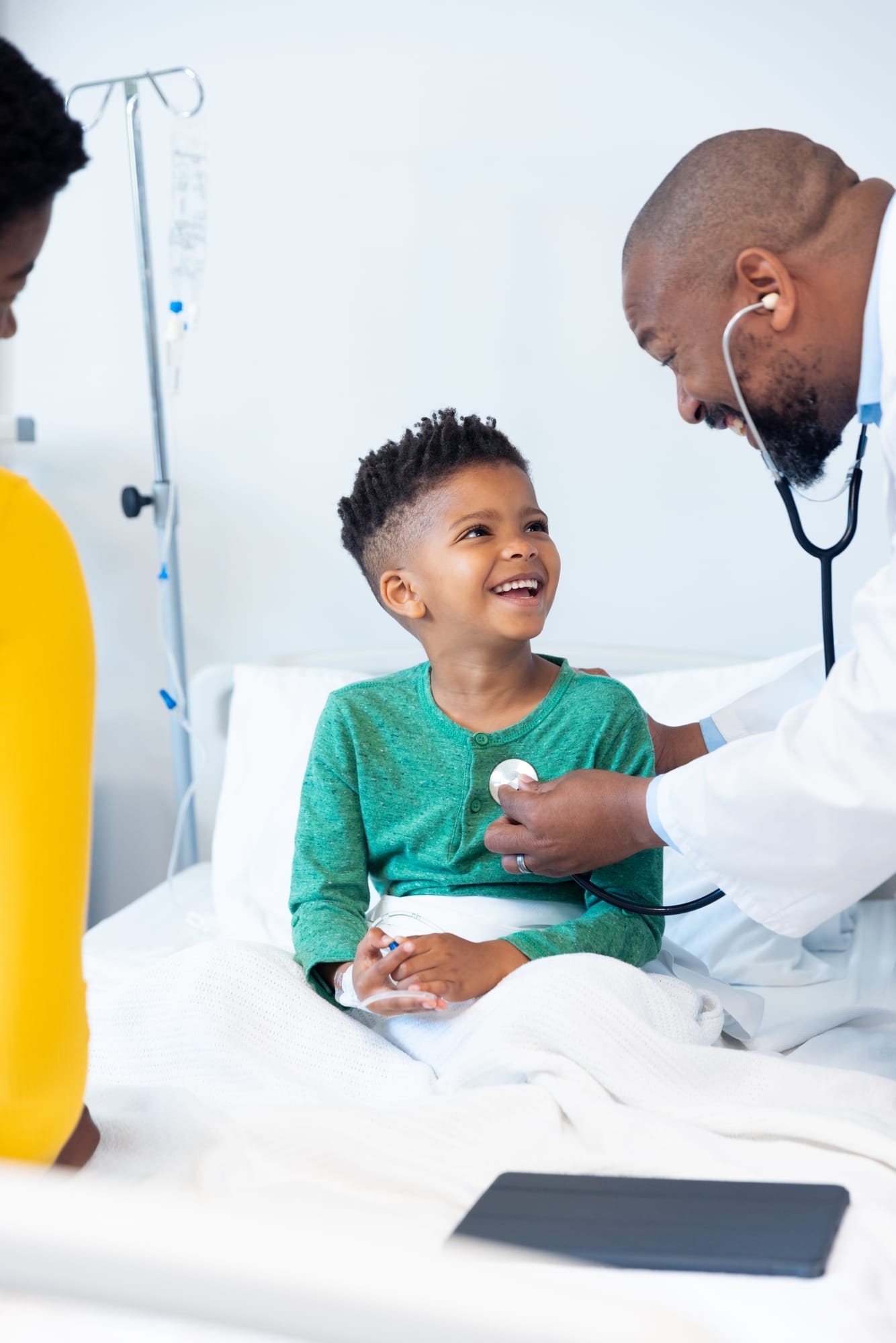A doctor examining a child with a stethoscope
